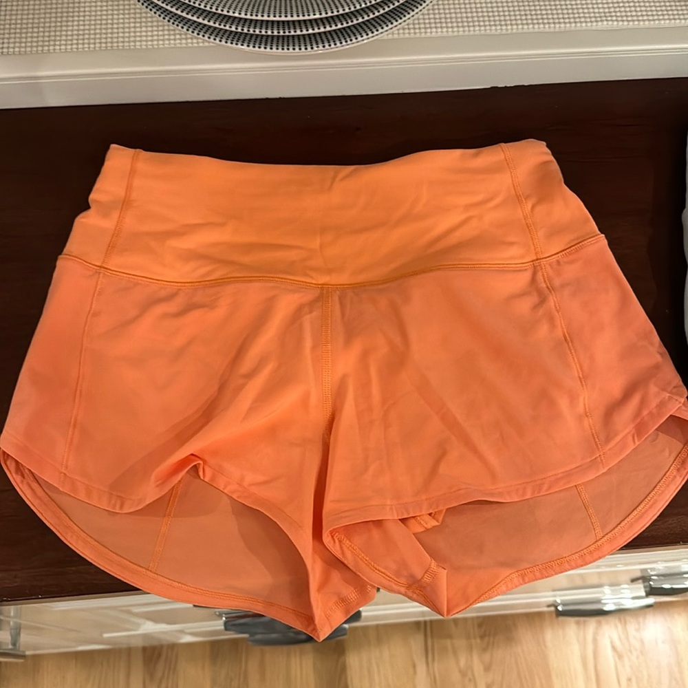 Lululemon orange shorts, size 4 women’s